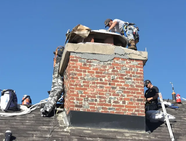 La Habra Chimney Sweep installing a custom chimney crown in La Habra, CA
