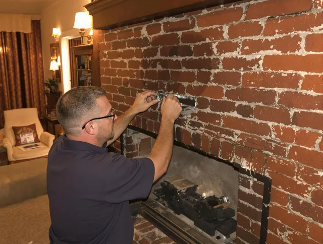 La Habra Chimney Sweep expert fixing a fireplace in La Habra, CA